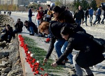 Baku residents bringing flowers to Seaside Boulevard to honor missing oil workers.  Azerbaijan, Dec.07, 2015